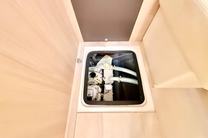  Yacht Photos Pics Engine compartment of 2016 Cranchi M44 HT yacht, showcasing internal components.