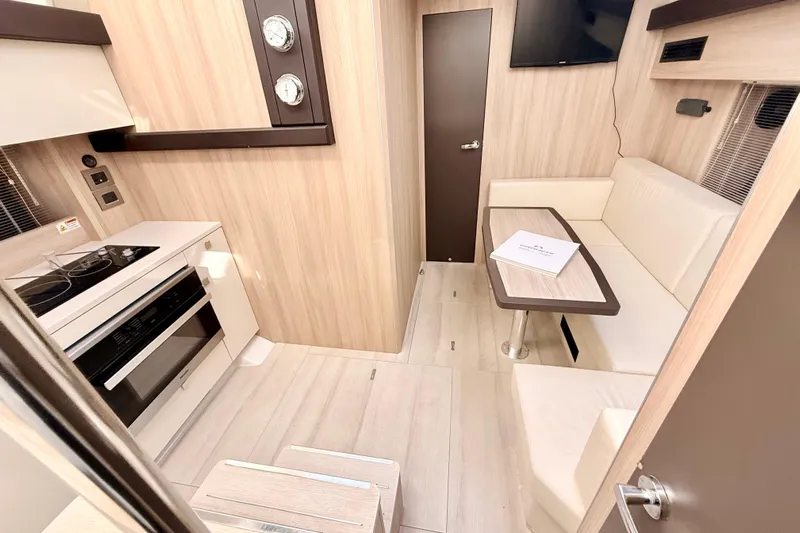  Yacht Photos Pics Interior of 2016 Cranchi M44 HT yacht with modern kitchen and seating area.