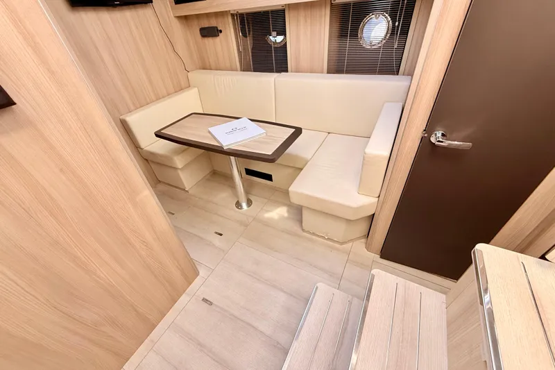 Yacht Photos Pics Luxurious interior of 2016 Cranchi M44 HT yacht with elegant seating and table.