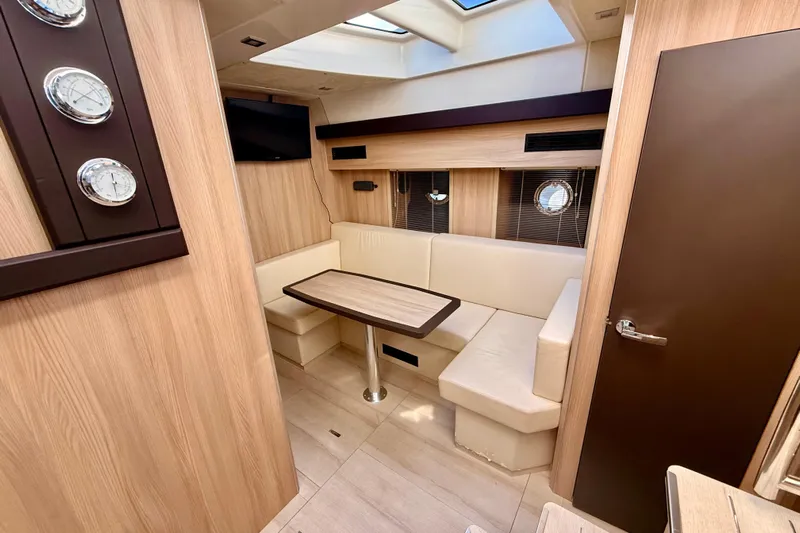  Yacht Photos Pics Interior of 2016 Cranchi M44 HT yacht with cozy seating and modern decor.
