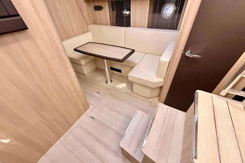  Yacht Photos Pics Interior of 2016 Cranchi M44 HT yacht with modern seating and wooden finishes.