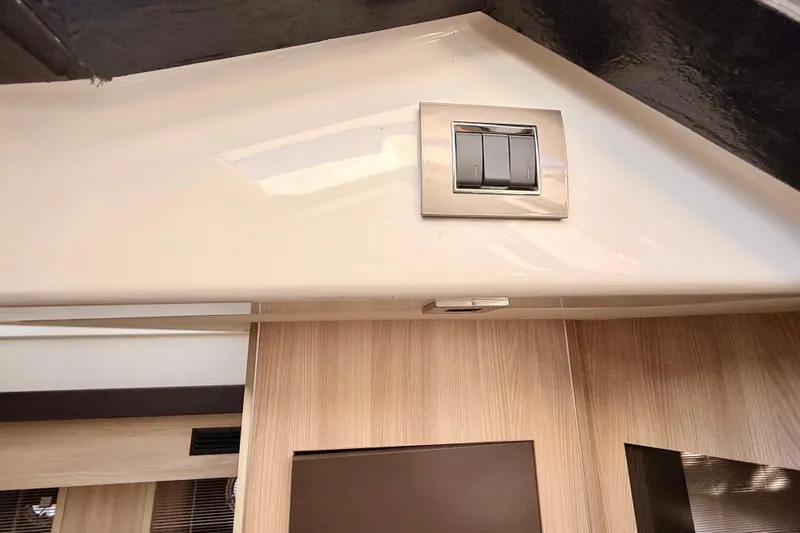  Yacht Photos Pics Interior of 2016 Cranchi M44 HT yacht with modern light switch panel.