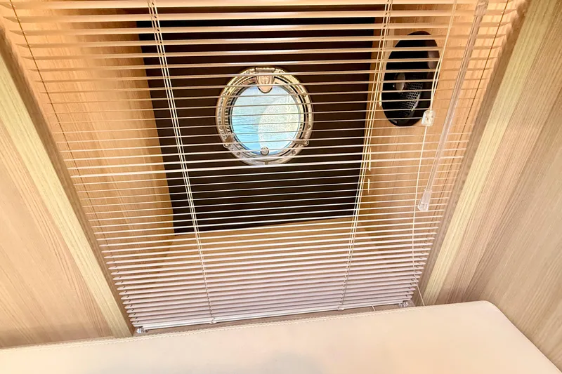  Yacht Photos Pics Interior of 2016 Cranchi M44 HT yacht with porthole and blinds.