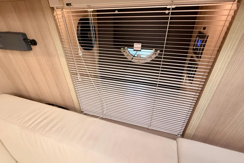  Yacht Photos Pics Interior of 2016 Cranchi M44 HT yacht with blinds and porthole.