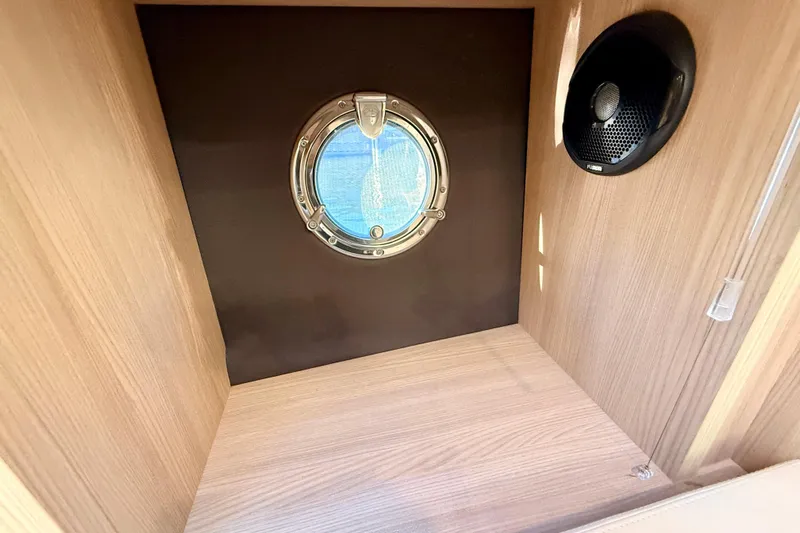  Yacht Photos Pics Interior of 2016 Cranchi M44 HT yacht with porthole and speaker.