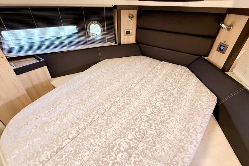  Yacht Photos Pics Luxurious bedroom interior of 2016 Cranchi M44 HT yacht with elegant bedding and modern design.