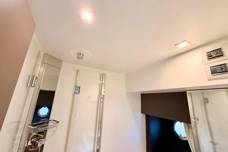  Yacht Photos Pics Modern bathroom interior of 2016 Cranchi M44 HT yacht with sleek fixtures and lighting.