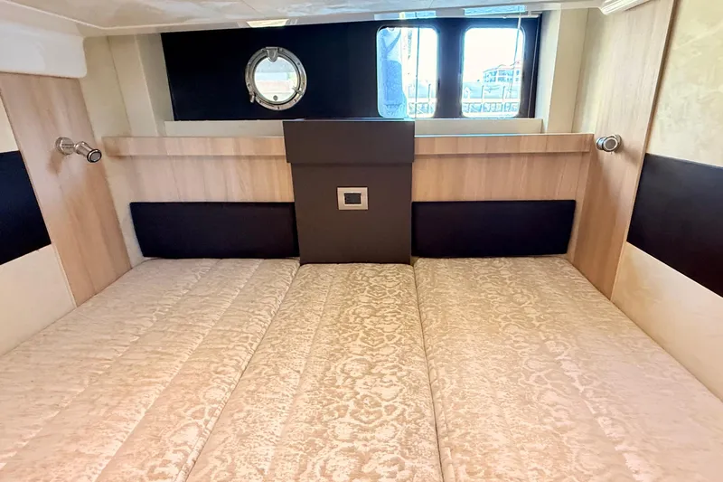  Yacht Photos Pics Luxurious interior cabin of 2016 Cranchi M44 HT yacht with elegant bedding.