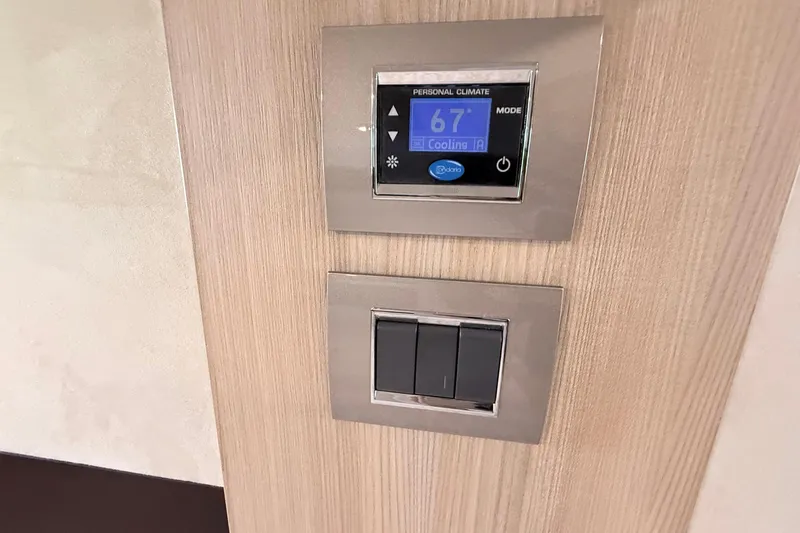  Yacht Photos Pics Climate control panel and switches on 2016 Cranchi M44 HT yacht interior.