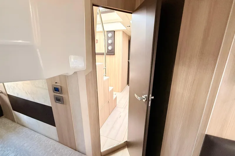  Yacht Photos Pics Interior view of 2016 Cranchi M44 HT yacht, featuring wooden finishes and modern design.