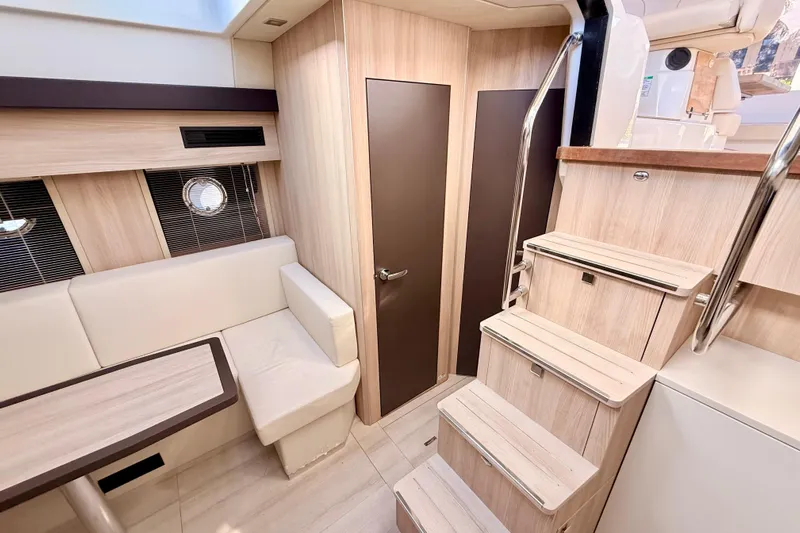 Yacht Photos Pics 2016 Cranchi M44 HT yacht interior with modern wood finish and seating area.