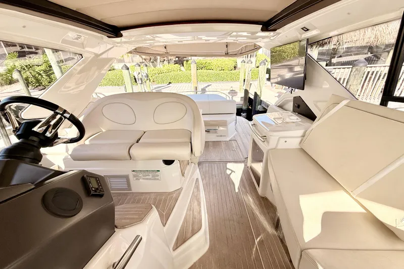  Yacht Photos Pics Interior of 2016 Cranchi M44 HT yacht with luxurious seating and modern helm.