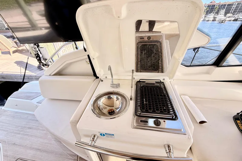  Yacht Photos Pics Outdoor kitchen on 2016 Cranchi M44 HT yacht with sink and grill.