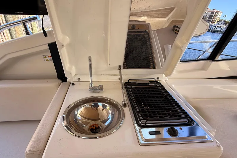  Yacht Photos Pics Outdoor kitchen on 2016 Cranchi M44 HT yacht with sink and grill.