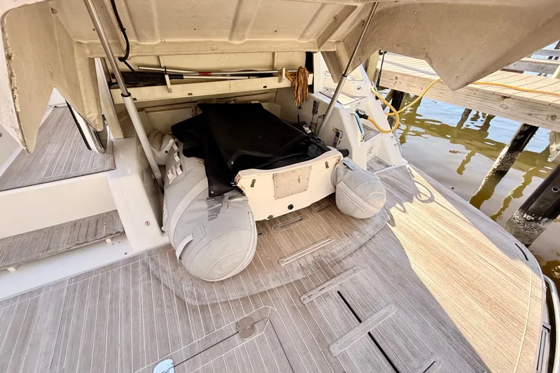  Yacht Photos Pics 2016 Cranchi M44 HT yacht with open storage compartment and inflatable boat.