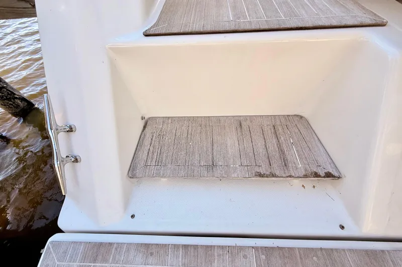  Yacht Photos Pics 2016 Cranchi M44 HT boat steps with wood finish near water.