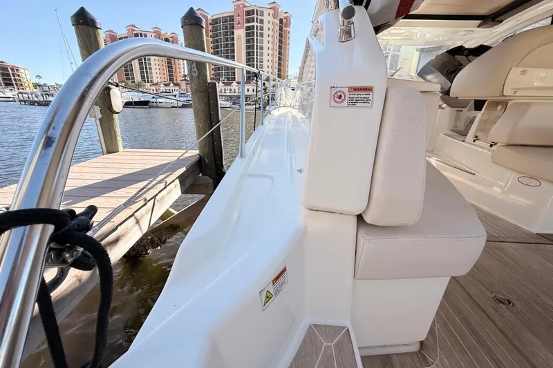  Yacht Photos Pics 2016 Cranchi M44 HT yacht docked at marina with luxury seating.