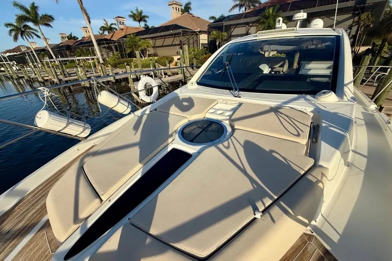  Yacht Photos Pics 2016 Cranchi M44 HT yacht docked, featuring sunbathing area and luxurious design.