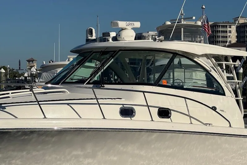  Yacht Photos Pics 2021 Pursuit OS 385 Offshore boat docked, featuring sleek design and modern equipment.