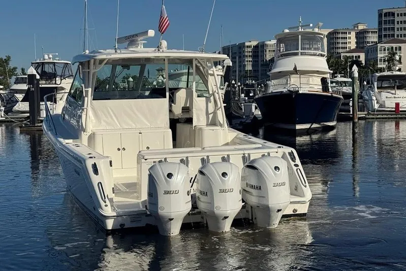  Yacht Photos Pics 2021 Pursuit OS 385 Offshore boat docked with triple Yamaha engines.