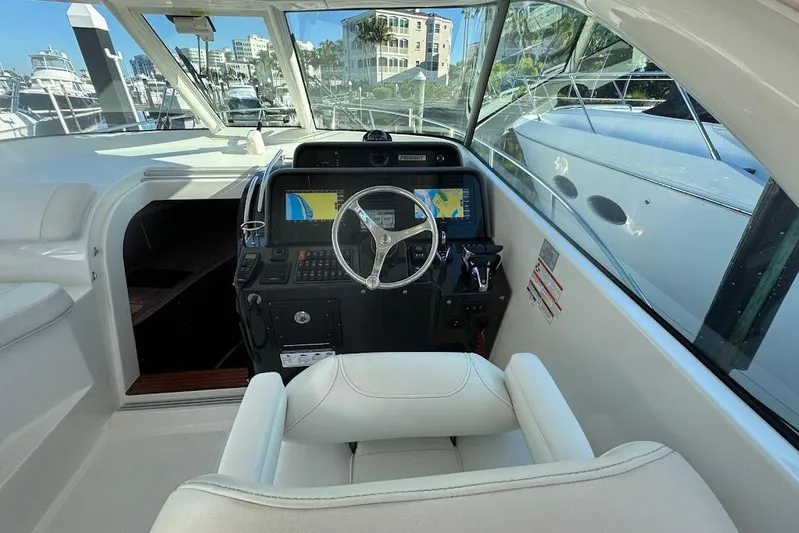  Yacht Photos Pics 2021 Pursuit OS 385 Offshore helm with modern navigation system and luxurious seating.