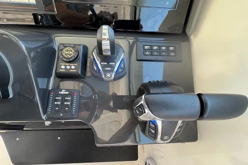  Yacht Photos Pics Control panel of 2021 Pursuit OS 385 Offshore boat with throttle and navigation controls.