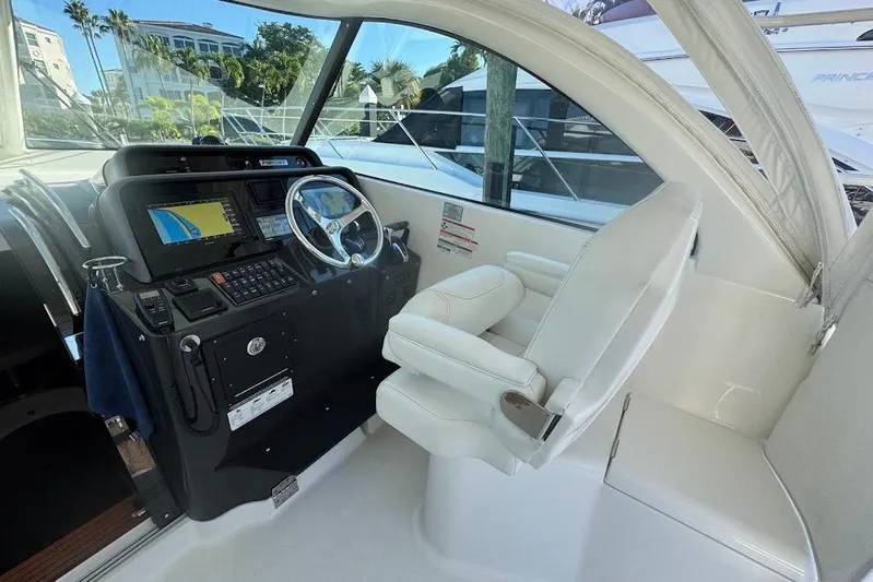  Yacht Photos Pics 2021 Pursuit OS 385 Offshore helm with modern navigation equipment and comfortable seating.