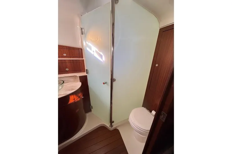  Yacht Photos Pics Luxurious bathroom in 2021 Pursuit OS 385 Offshore boat with modern fixtures.
