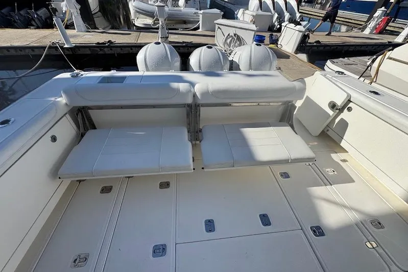  Yacht Photos Pics 2021 Pursuit OS 385 Offshore boat with foldable seating and spacious deck layout.
