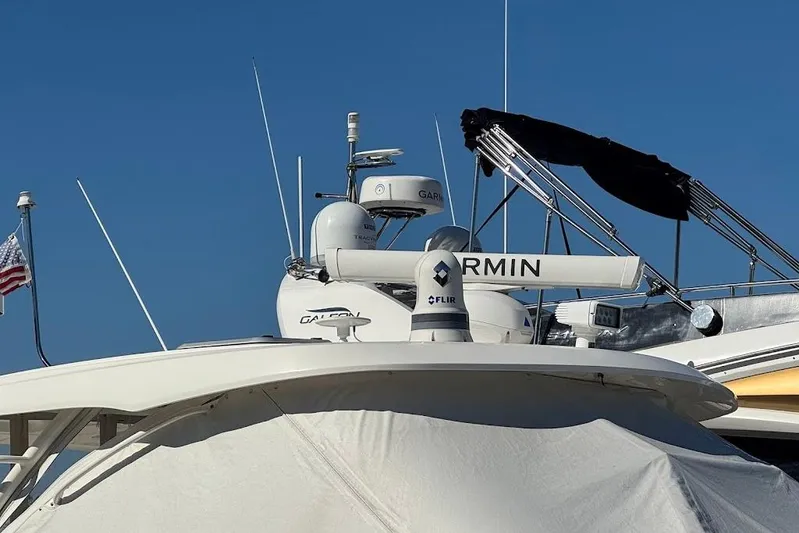  Yacht Photos Pics 2021 Pursuit OS 385 Offshore boat with Garmin and FLIR equipment, blue sky background.