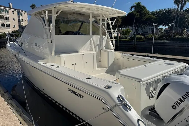  Yacht Photos Pics 2021 Pursuit OS 385 Offshore boat docked, featuring Yamaha outboard engine.