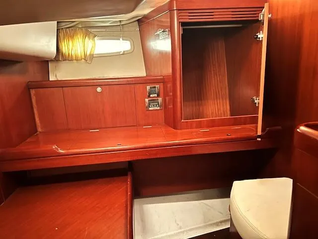 Lotus II Yacht Photos Pics Interior of 2007 Beneteau Oceanis 46 yacht with wooden cabinetry and seating.