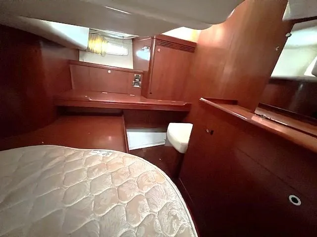 Lotus II Yacht Photos Pics Interior cabin of 2007 Beneteau Oceanis 46 yacht with wooden furnishings.
