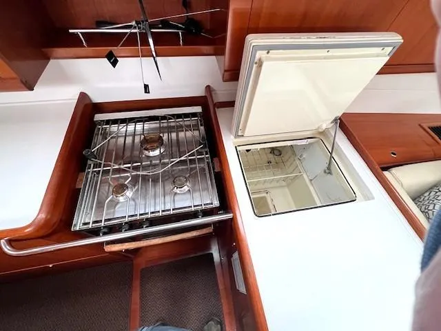 Lotus II Yacht Photos Pics Beneteau Oceanis 46 (2007) yacht kitchen with stove and storage compartments.