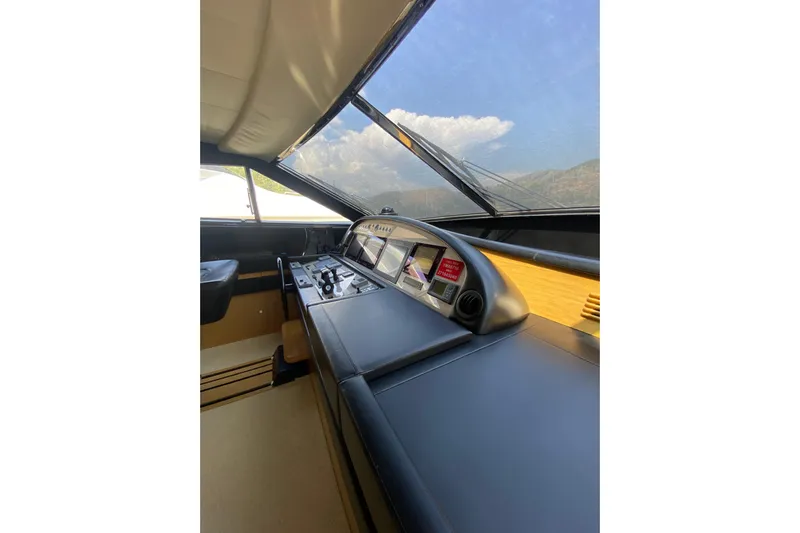 Slt Yacht Photos Pics 2008 Ferretti Yachts 881 helm with modern navigation controls and panoramic view.