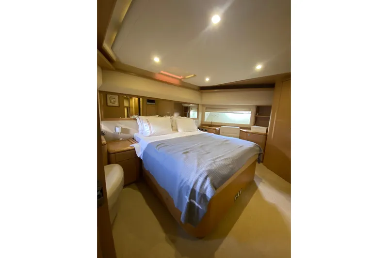 Slt Yacht Photos Pics Luxurious bedroom interior of 2008 Ferretti Yachts 881, featuring elegant bedding and ambient lighting.