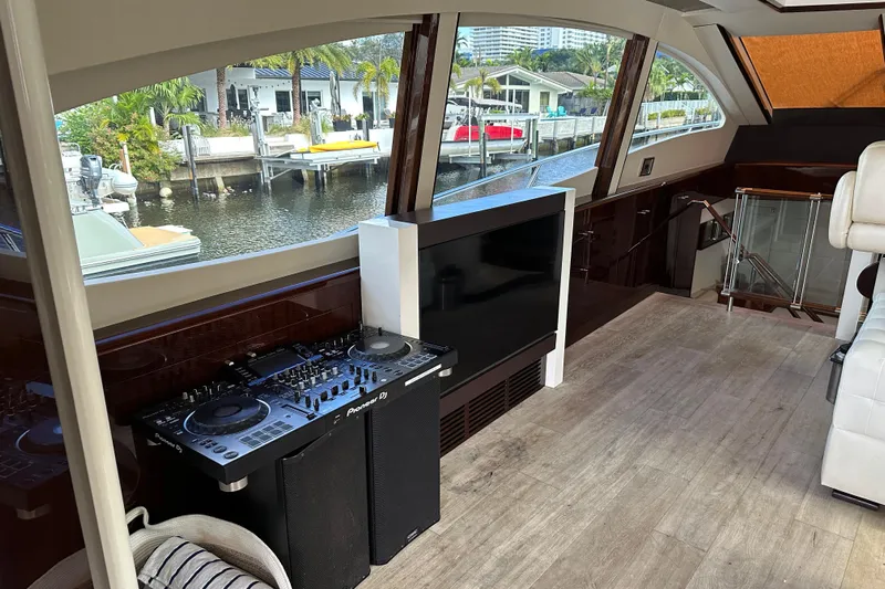  Yacht Photos Pics Luxurious 2009 Lazzara LSX 75 yacht interior with DJ equipment and waterfront view.