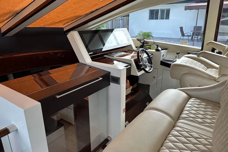  Yacht Photos Pics Luxurious interior of a 2009 Lazzara LSX 75 yacht with leather seating and modern controls.