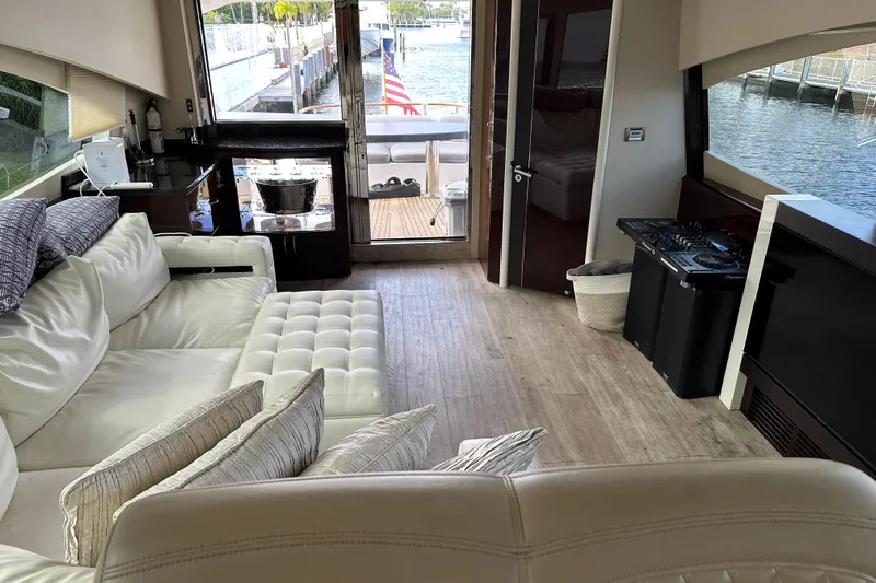  Yacht Photos Pics Luxurious interior of 2009 Lazzara LSX 75 yacht with plush seating and waterfront view.
