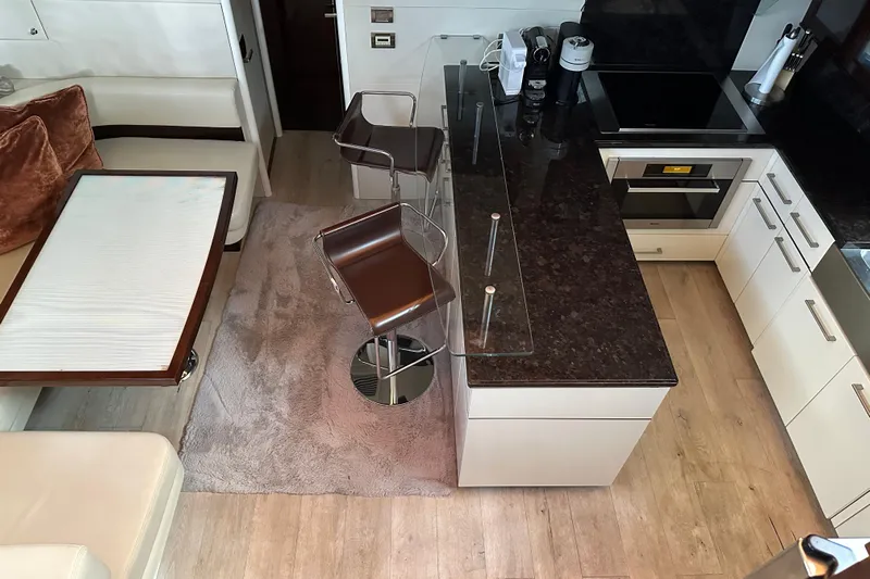  Yacht Photos Pics Luxurious kitchen interior of 2009 Lazzara LSX 75 yacht with modern appliances and seating.