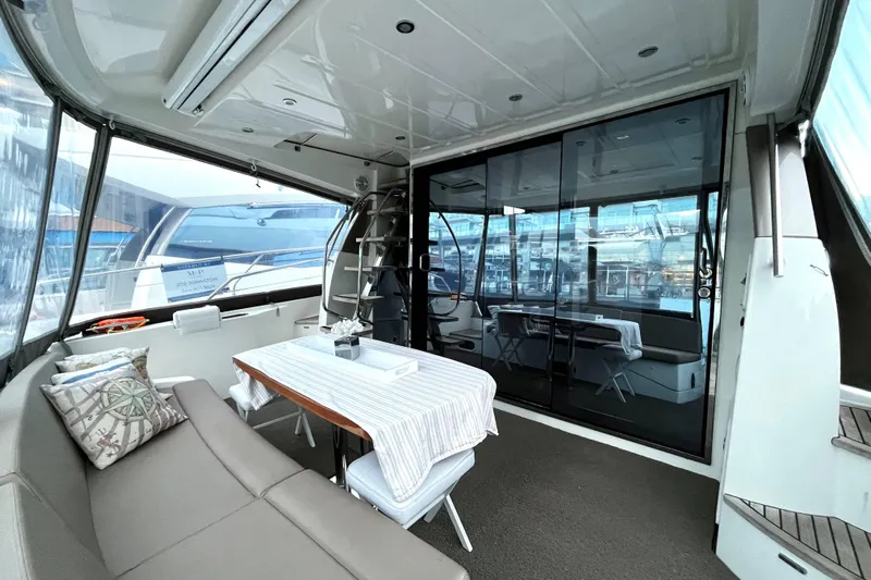  Yacht Photos Pics Luxurious 2014 Prestige 500 yacht interior with elegant seating and dining area.