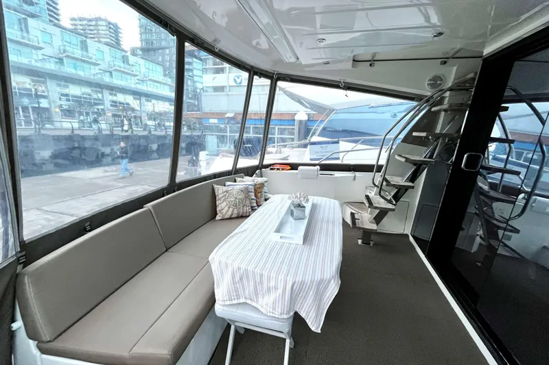  Yacht Photos Pics Luxurious interior of 2014 Prestige 500 yacht with seating and table.