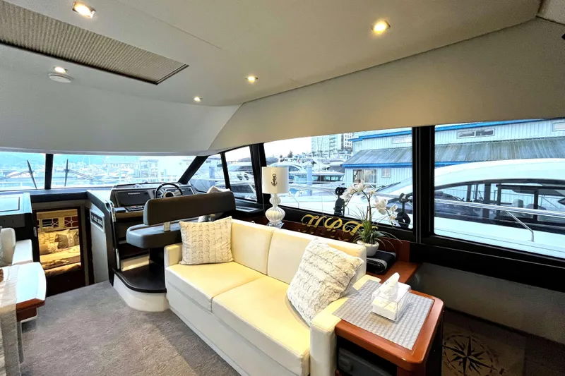  Yacht Photos Pics Luxurious interior of a 2014 Prestige 500 yacht with elegant seating and panoramic windows.