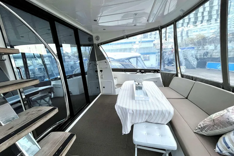  Yacht Photos Pics Luxurious interior of a 2014 Prestige 500 yacht with elegant seating and dining area.