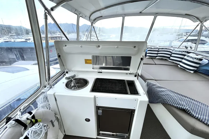  Yacht Photos Pics 2014 Prestige 500 yacht interior with kitchenette and seating area.