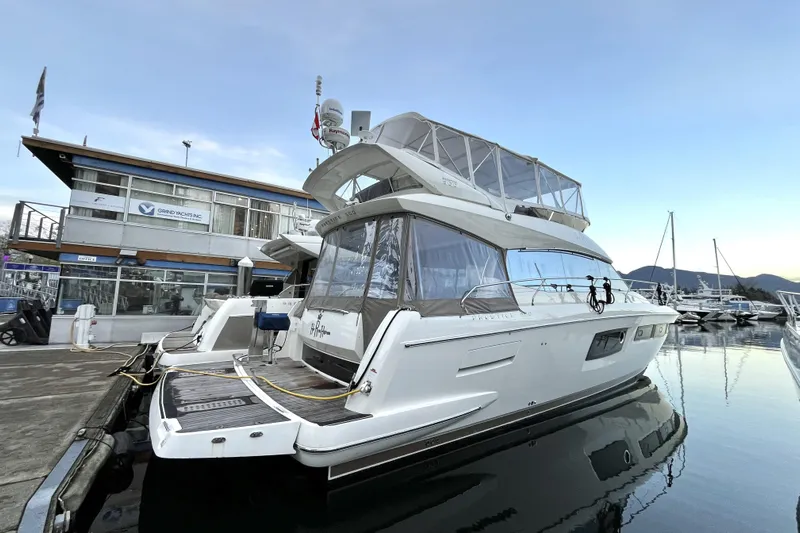  Yacht Photos Pics 2014 Prestige 500 yacht docked at marina, clear sky, modern design.