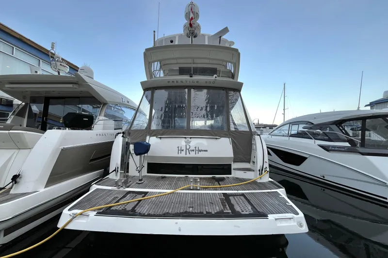  Yacht Photos Pics 2014 Prestige 500 yacht docked at marina, rear view with clear sky.