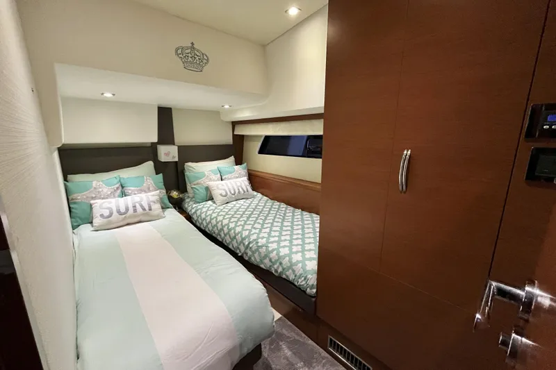  Yacht Photos Pics Luxurious twin bedroom in 2014 Prestige 500 yacht with stylish decor and surf-themed pillows.