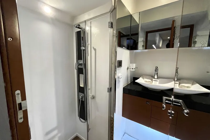  Yacht Photos Pics Luxurious bathroom in 2014 Prestige 500 yacht with modern shower and dual sinks.