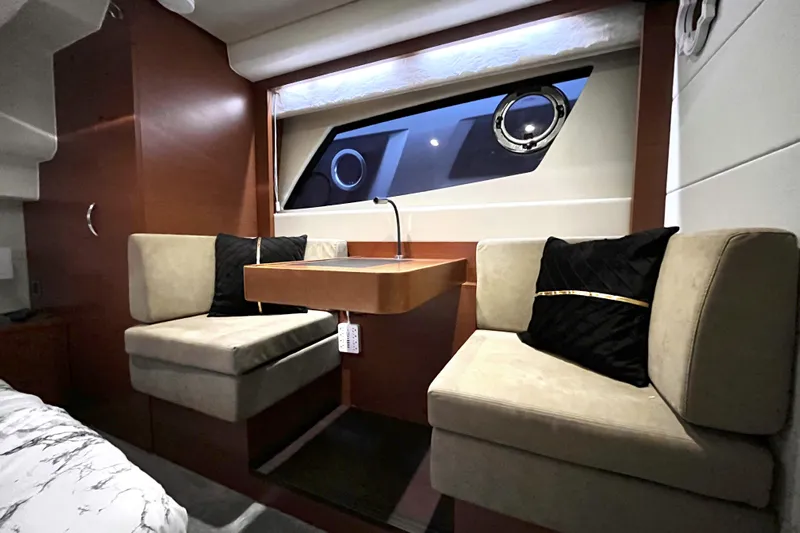  Yacht Photos Pics Luxurious interior of 2014 Prestige 500 yacht with elegant seating and window view.